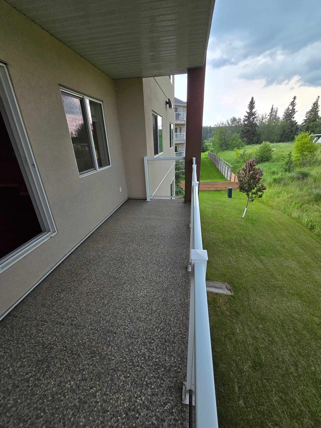 a view of the front porch of a house from a balcony