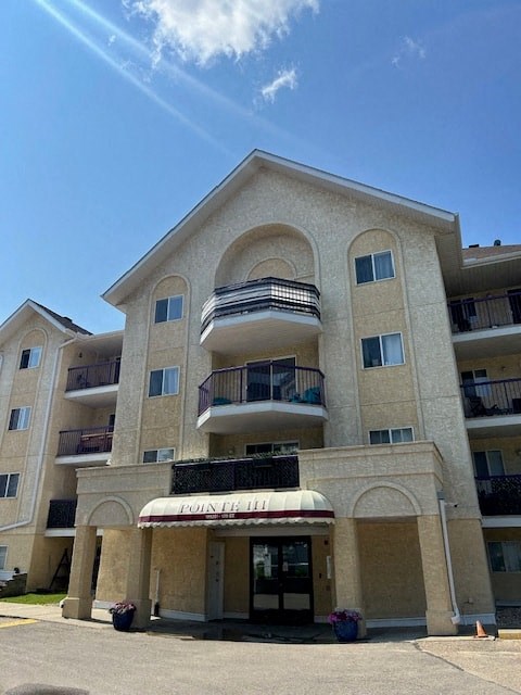 a building with two balconies and an awning