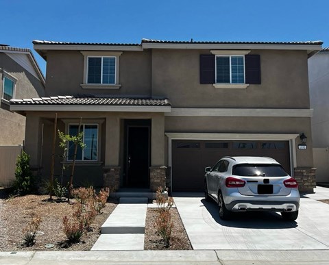 a house with a car parked in front of it