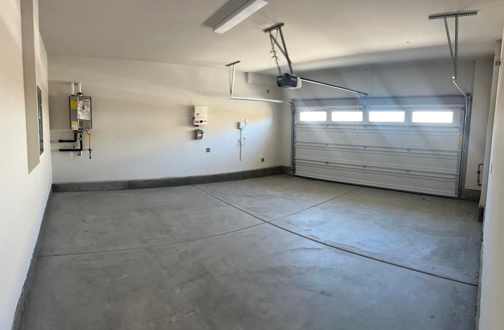 the inside of a garage with a garage door