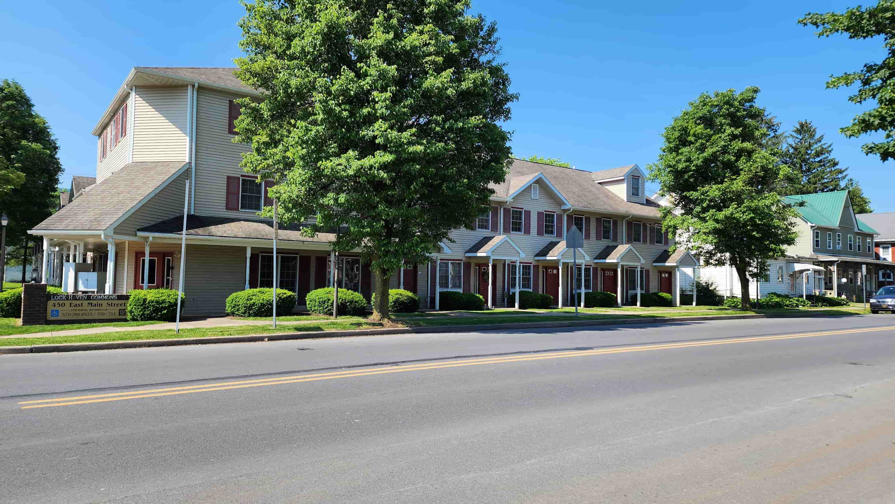 a row of houses on the side of a street