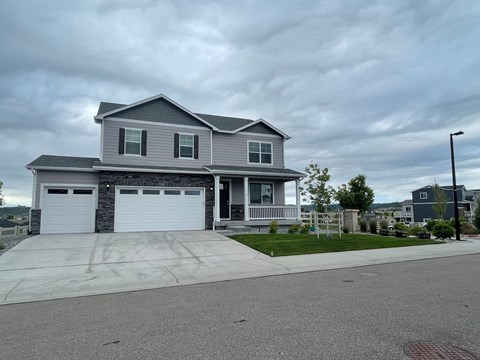 a house with a driveway and a garage door
