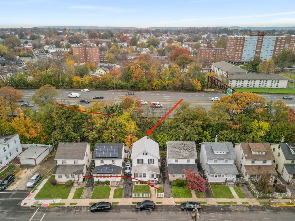 a neighborhood of houses with solar panels on the roofs