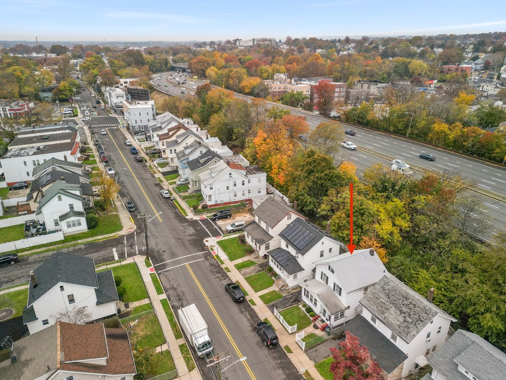 an aerial view of a neighborhood with houses and trees
