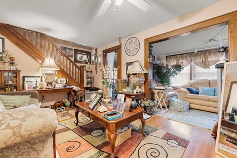 a living room filled with furniture and a large window