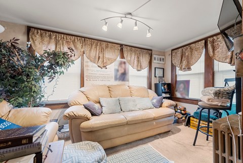 a living room with a couch and a large window