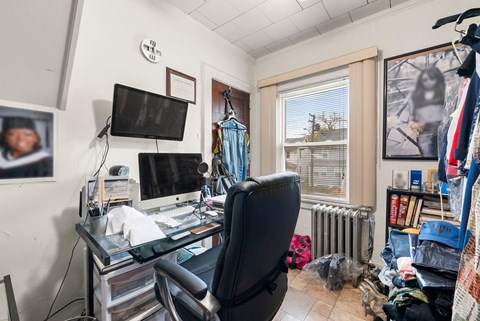 a home office with a desk and a computer