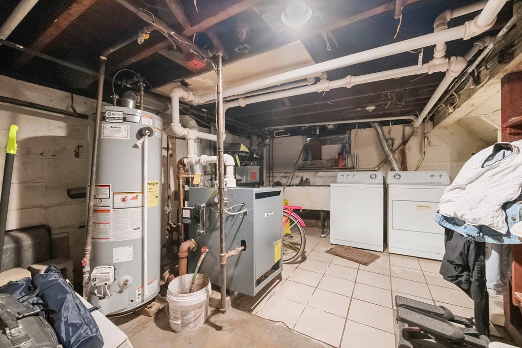 the basement of a home with a lot of heating and cooling equipment