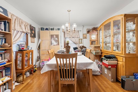 a dining room with a table and chairs