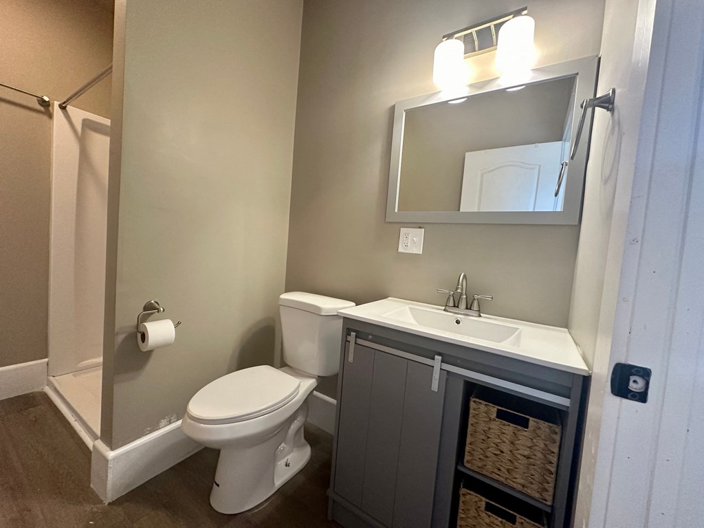 a small bathroom with a toilet sink and shower