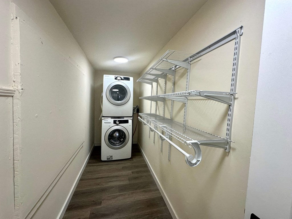 a washer and dryer in a small room with a closet