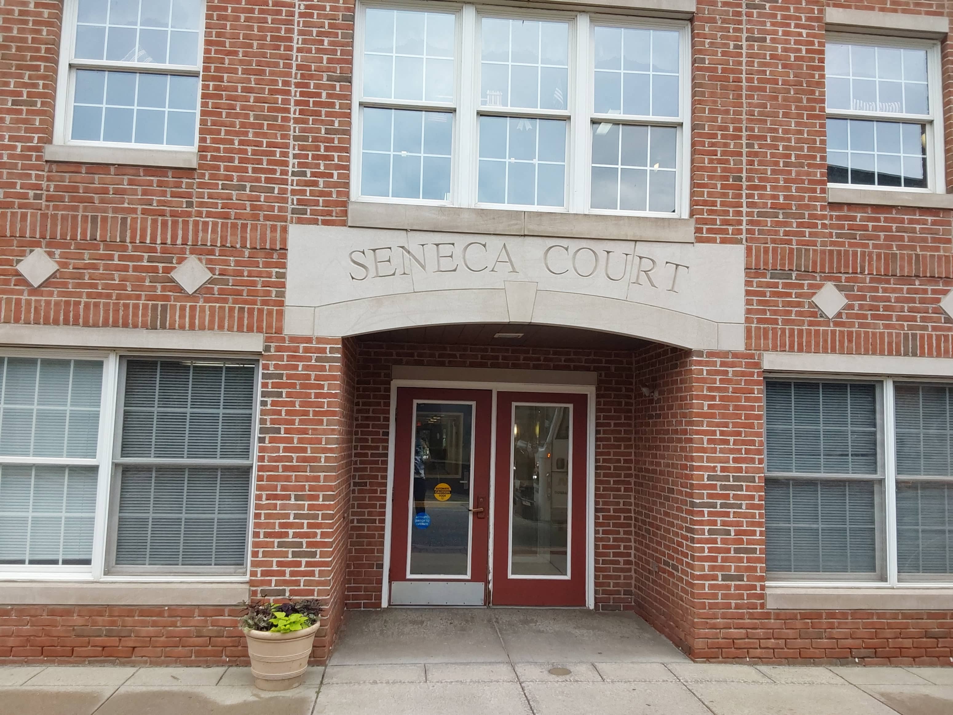 the front entrance of the seneca court building