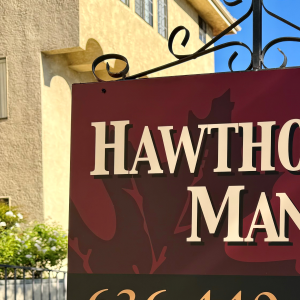 Hawthorne Manor Apartments a sign for hawthorne manor in front of a building