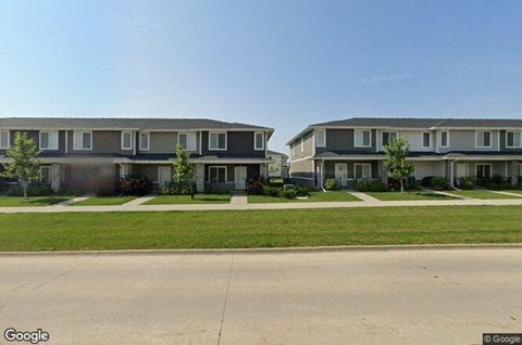 a row of houses on the side of a street