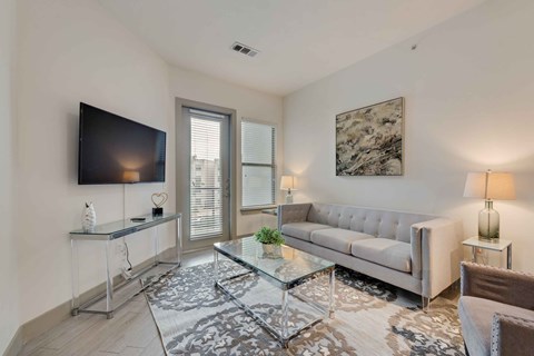 a living room with a couch and a tv