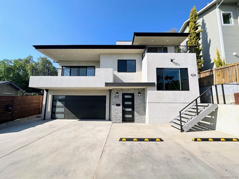 A modern two-story house with a garage.