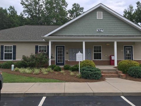 a house with a white sign in front of it