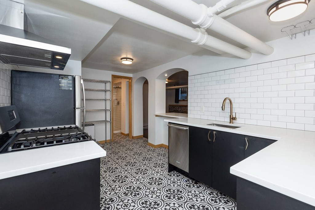 a kitchen with a stove and a sink
