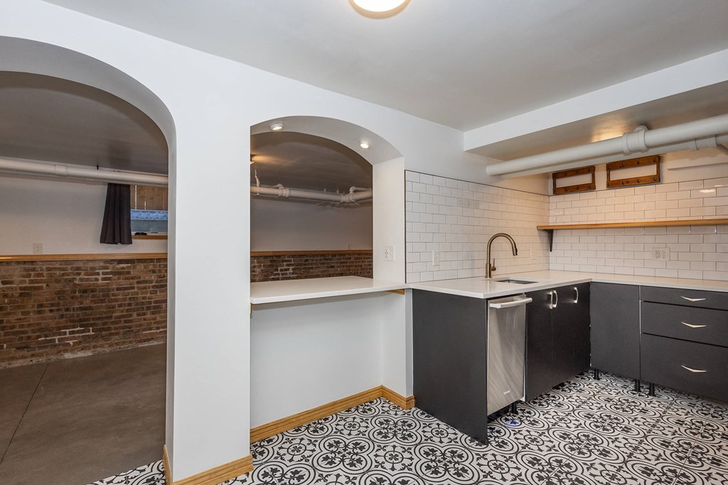 a kitchen with a counter top and a sink