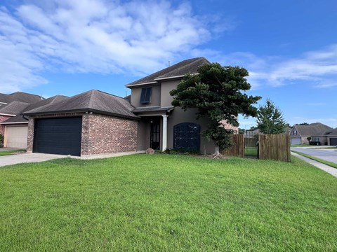 a house with a yard in front of it