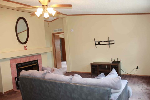 a living room with a couch and a fireplace