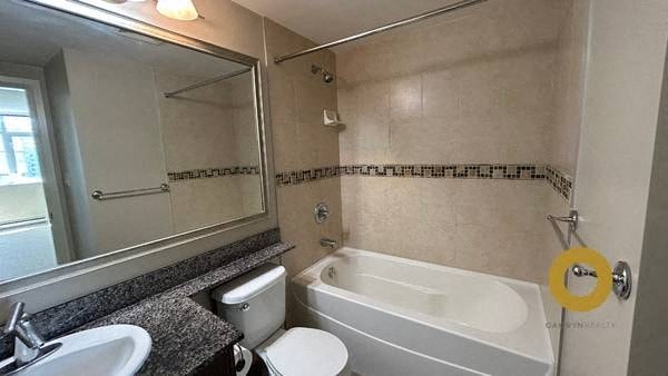 a bathroom with a sink toilet and a bath tub