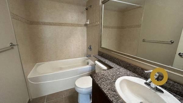 a bathroom with a sink toilet and a bath tub