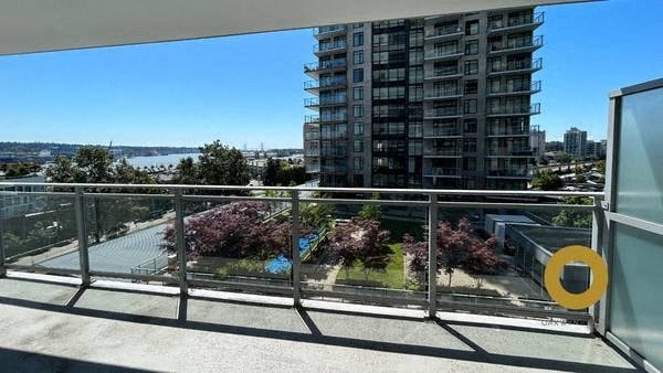 a balcony with a view of a city and a river