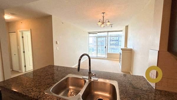 a kitchen with a stainless steel sink