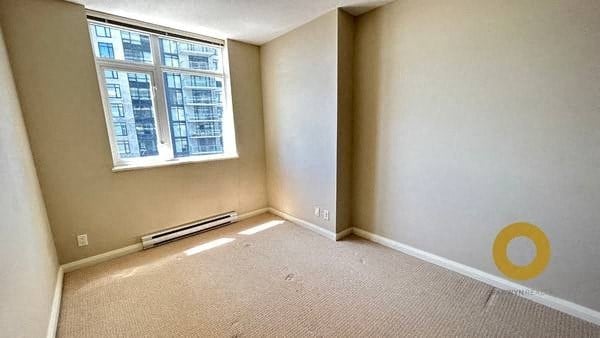 an empty room with a large window and