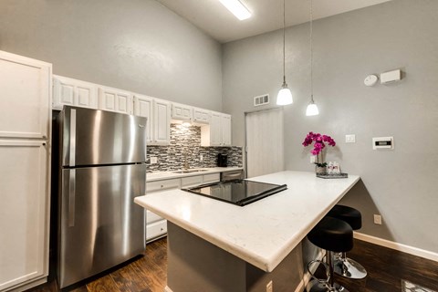 a kitchen with stainless steel appliances and a counter top