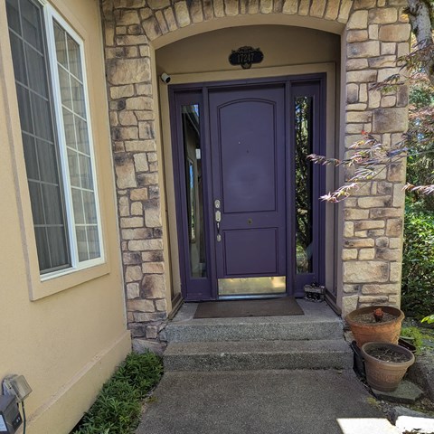 A purple door is the main focus of this image.