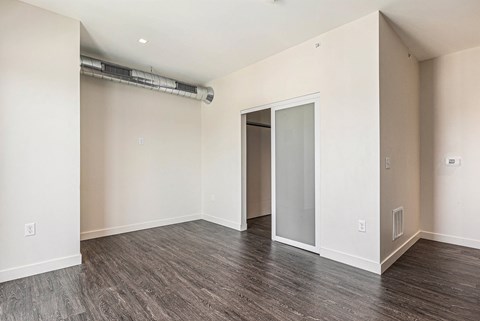 A room with a sliding door and a window.