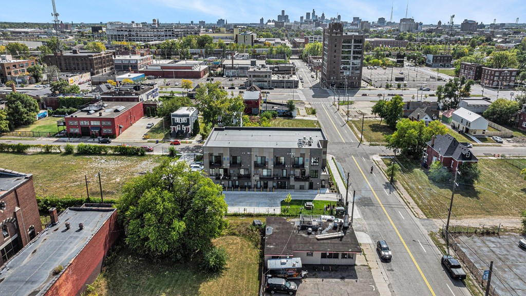 A city street with cars and buildings.