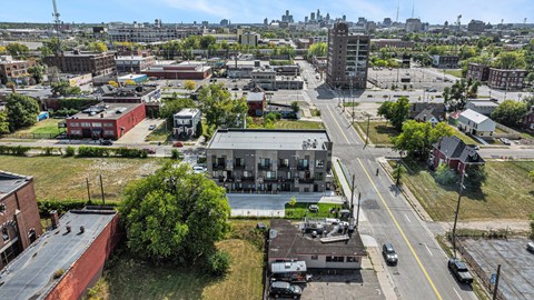 A city street with cars and buildings.