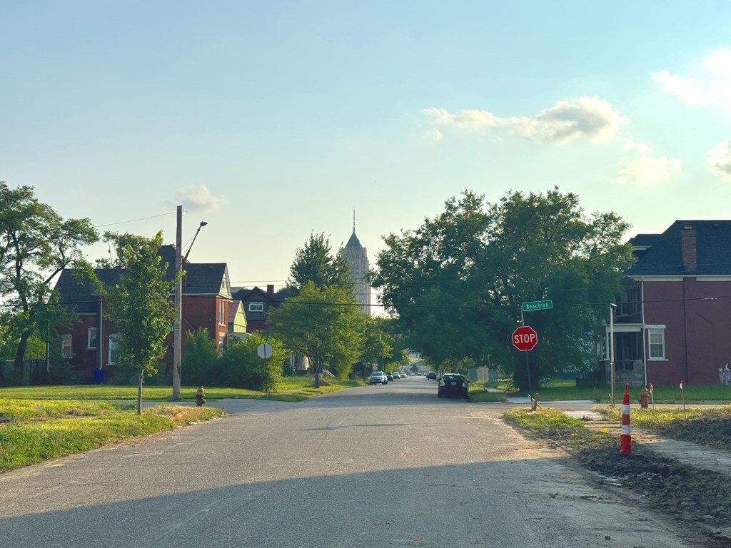 A stop sign is on the right side of a street.