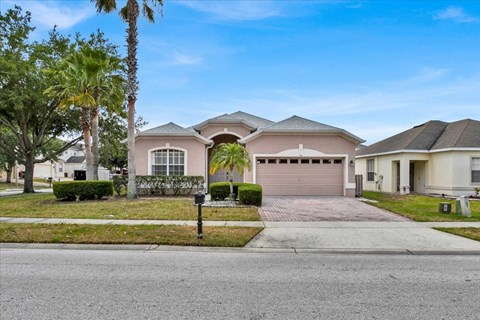 a house with a driveway and a garage door