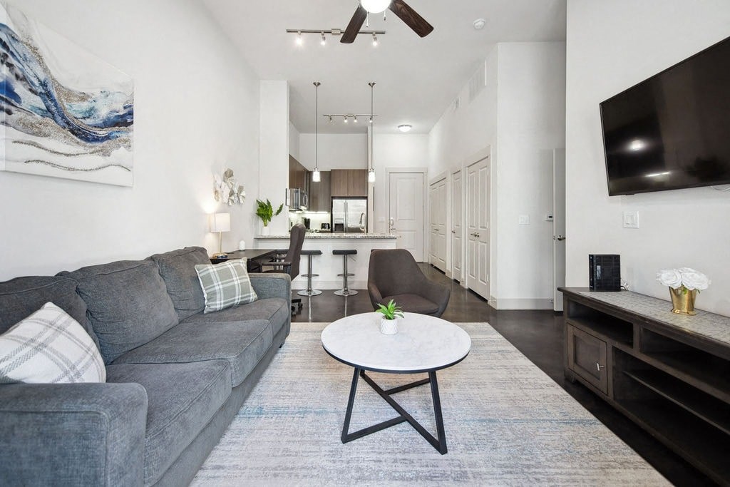 a living room with a couch and a table