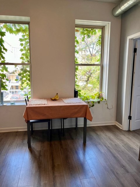 A table with a tablecloth and a banana on it.