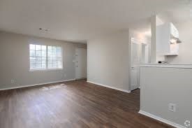 A room with wooden floors and white walls.
