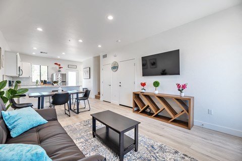 a living room with a couch and a table and a tv