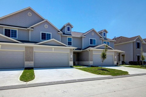 a house with a driveway and a street in front of it