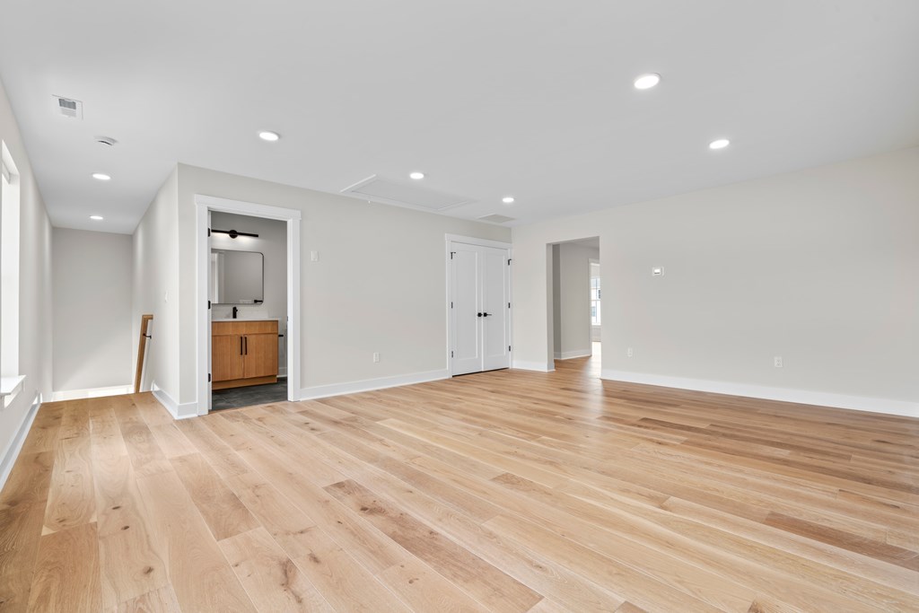 A room with wooden floors and white walls.