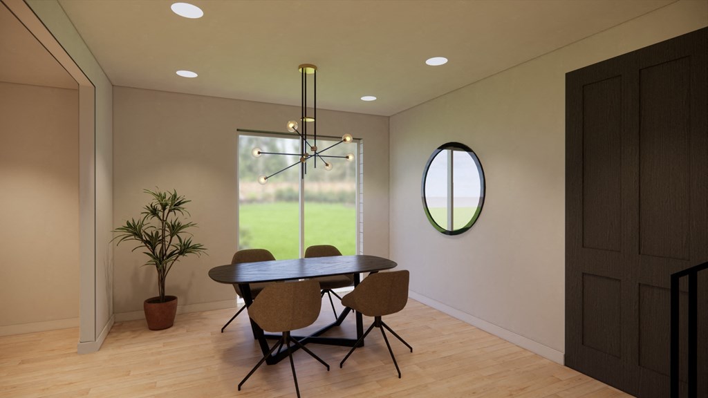 a dining room with a table and chairs