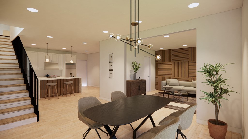 a living room and dining room with a table and chairs