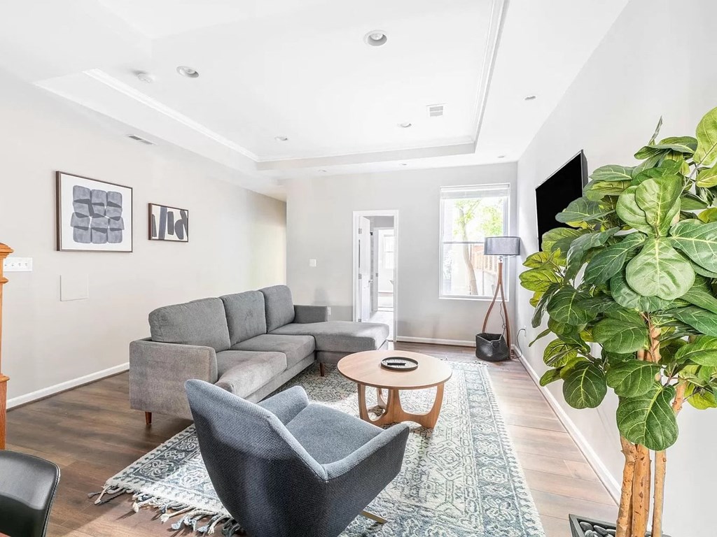 a living room with a couch and a table