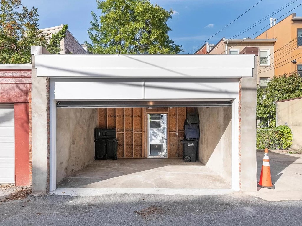a small parking garage with a door open