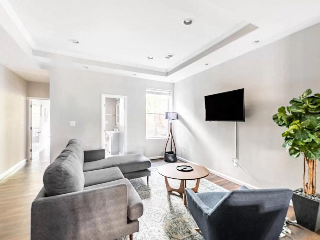 a living room with a couch and a tv