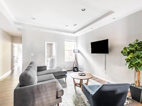 a living room with a couch and a tv