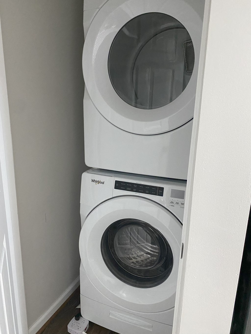 a washing machine and a dryer in a small closet